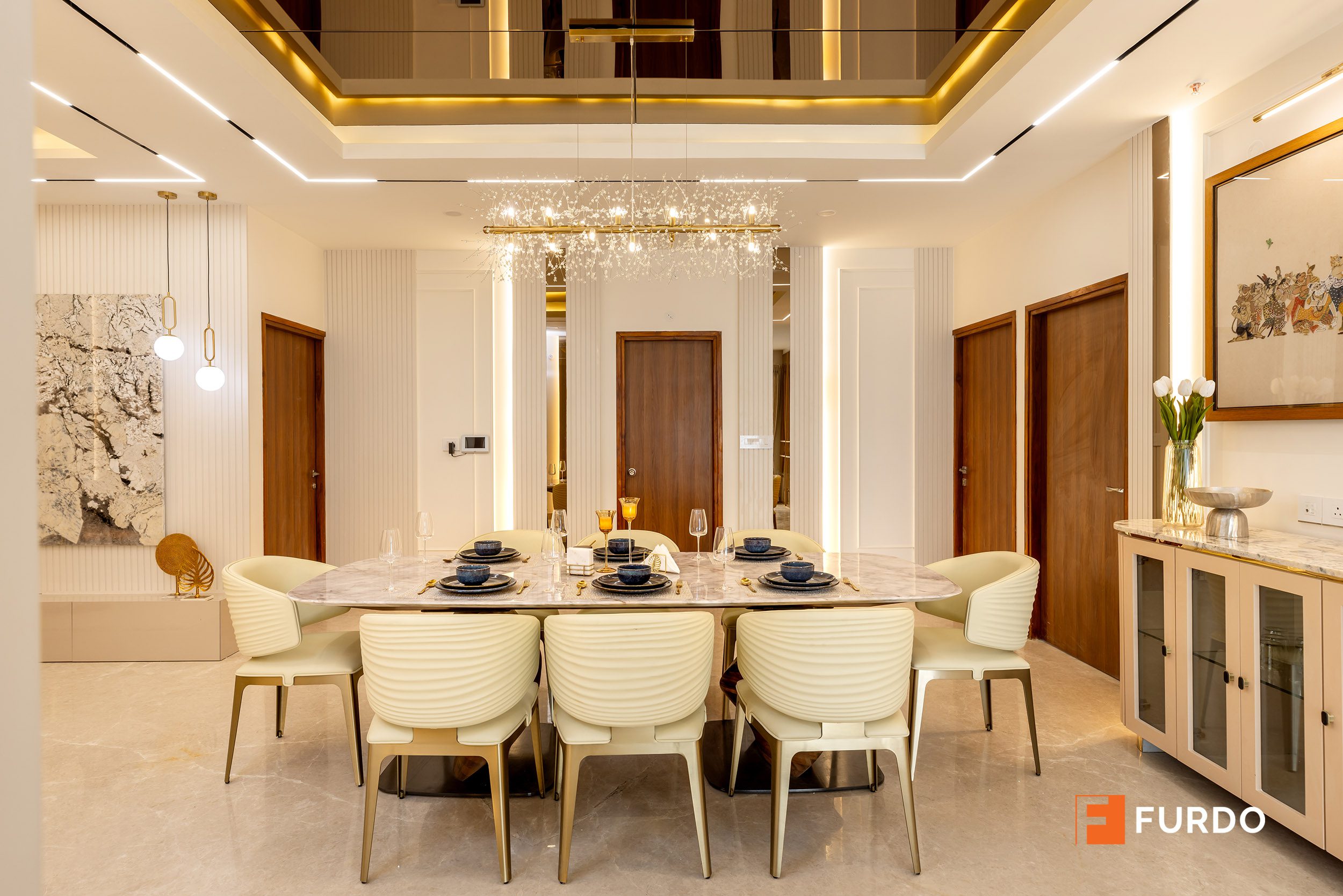 Luxury dining room interior design Hyderabad — Auro Kohinoor, marble-topped table