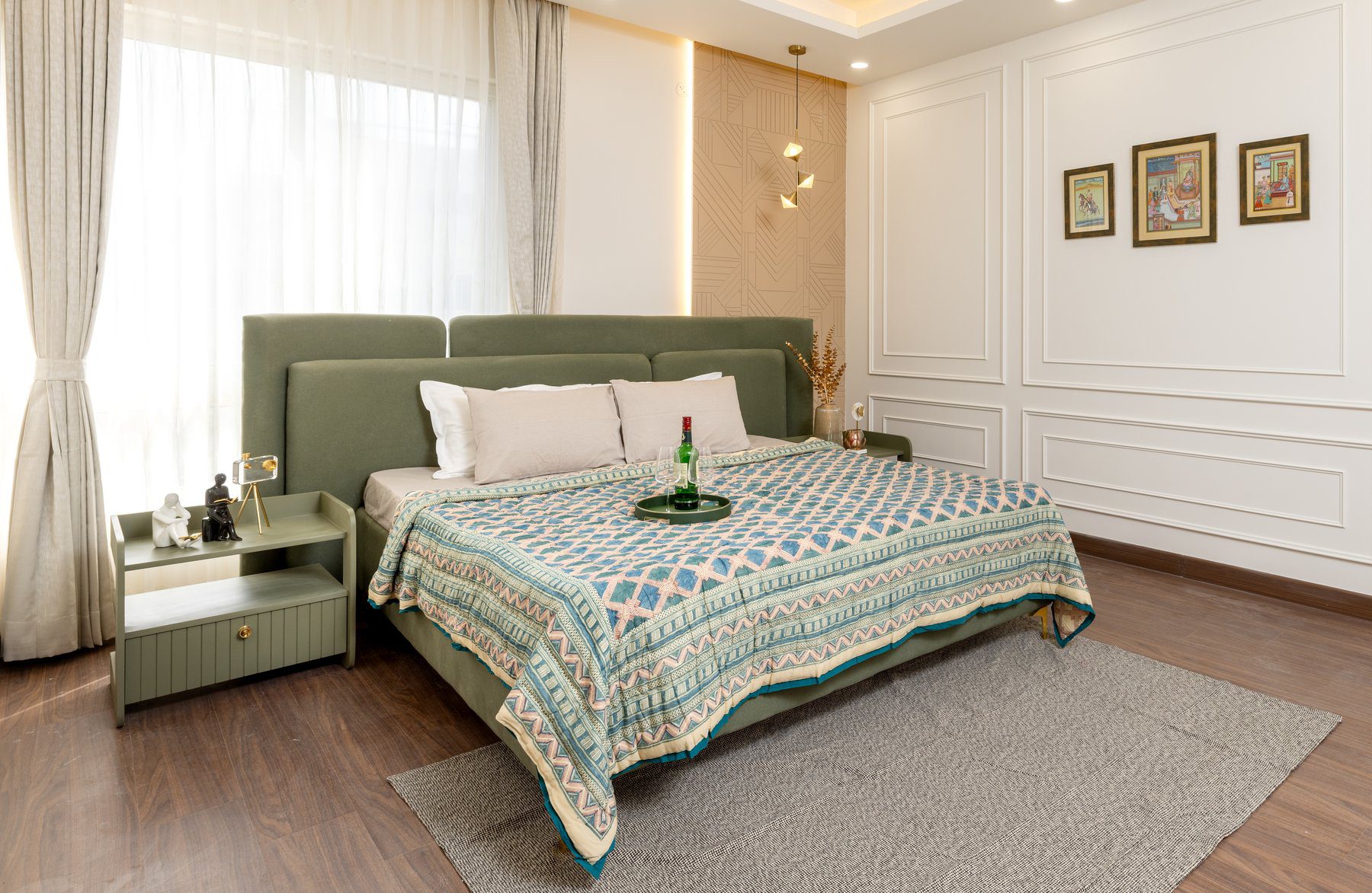 Luxury bedroom interior design Hyderabad — upholstered headboard and gallery wall
